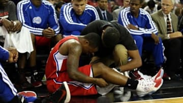 Oct 14, 2013; Sacramento, CA, USA; Los Angeles Clippers point guard Maalik Wayns (5) speaks with a trainer on the sideline during the second quarter against the Sacramento Kings at Sleep Train Arena. Mandatory Credit: Kelley L Cox-USA TODAY Sports