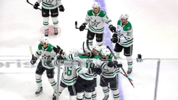 EDMONTON, ALBERTA - SEPTEMBER 26: Corey Perry #10 of the Dallas Stars is congratulated by his teammates after scoring the game-winning goal during the second overtime period against the Tampa Bay Lightning to give the Stars the 3-2 victory in Game Five of the 2020 NHL Stanley Cup Final at Rogers Place on September 26, 2020 in Edmonton, Alberta, Canada. (Photo by Bruce Bennett/Getty Images)