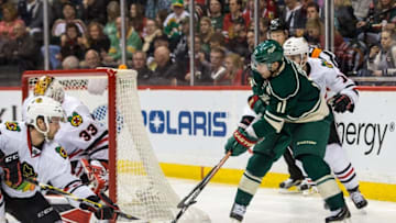 Mar 29, 2016; Saint Paul, MN, USA; Minnesota Wild forward Zach Parise (11) shoots the puck during the second period against the Chicago Blackhawks at Xcel Energy Center. Mandatory Credit: Brace Hemmelgarn-USA TODAY Sports