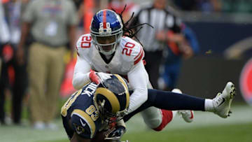 Oct 23, 2016; London, United Kingdom; Los Angeles Rams wide receiver Brian Quick (83) is tackled by New York Giants cornerback Janoris Jenkins (20) during game 16 of the NFL International Series at Twickenham Stadium. Mandatory Credit: Kirby Lee-USA TODAY Sports