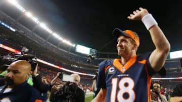 Oct 19, 2014; Denver, CO, USA; Denver Broncos quarterback Peyton Manning (18) waves to the crowd as he runs off the field after the game against the San Francisco 49ers at Sports Authority Field at Mile High. Mandatory Credit: Chris Humphreys-USA TODAY Sports