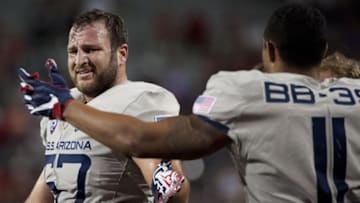 Sep 17, 2016; Tucson, AZ, USA; Arizona Wildcats linebacker Cody Ippolito (57) and linebacker Michael Barton (11) high five during the third quarter against the Hawaii Warriors at Arizona Stadium. Mandatory Credit: Casey Sapio-USA TODAY Sports
