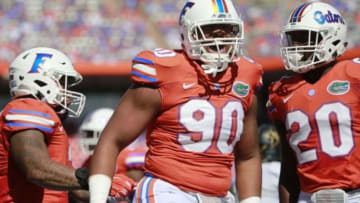 Nov 7, 2015; Gainesville, FL, USA; Florida Gators defensive lineman Jonathan Bullard (90) celebrates as he makes a tackle against the Vanderbilt Commodores during the first quarter at Ben Hill Griffin Stadium. Mandatory Credit: Kim Klement-USA TODAY Sports