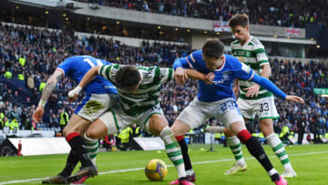 GLASGOW, SCOTLAND - FEBRUARY 26: Hyeongyu Oh of Celtic holds off Ryan Kent and Scott Wright of Rangers during the Viaplay League Cup Final between Rangers and Celtic at Hampden Park on February 26, 2023 in Glasgow, Scotland. (Photo by Mark Runnacles/Getty Images)