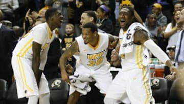 Feb 17, 2015; Richmond, VA, USA; Virginia Commonwealth Rams forward Jarred Guest (23), guard Jordan Burgess (20), and forward Mo Alie-Cox (12) celebrate on the bench against the Saint Louis Billikens in the second half at Stuart Siegel Center. The Rams won 74-54. Mandatory Credit: Geoff Burke-USA TODAY Sports