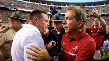 KNOXVILLE, TN - OCTOBER 15: Head coach Nick Saban of the Alabama Crimson Tide shakes hands with head coach Butch Jones of the Tennessee Volunteers after their 49-10 win at Neyland Stadium on October 15, 2016 in Knoxville, Tennessee. (Photo by Kevin C. Cox/Getty Images)