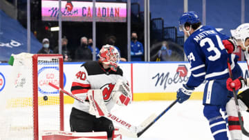 Jan 31, 2022; Toronto, Ontario, CAN; Toronto Maple Leafs forward Auston Matthews (34) scores his second goal past New Jersey Devils goalie Akira Schid (40) in the first period at Scotiabank Arena. Mandatory Credit: Dan Hamilton-USA TODAY Sports