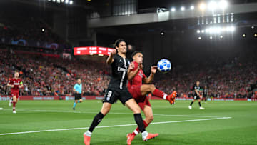 LIVERPOOL, ENGLAND - SEPTEMBER 18: Trent Alexander-Arnold of Liverpool battles for possession with Edinson Cavani of Paris Saint-Germain during the Group C match of the UEFA Champions League between Liverpool and Paris Saint-Germain at Anfield on September 18, 2018 in Liverpool, United Kingdom. (Photo by Michael Regan/Getty Images)