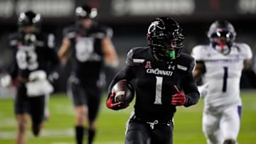 Cincinnati Bearcats wide receiver Tre Tucker runs in a touchdown against the East Carolina Pirates at Nippert Stadium. The Enquirer.
