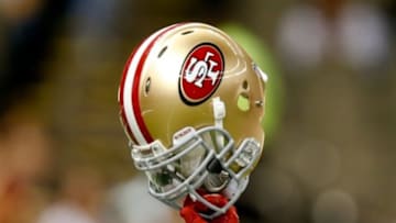 Nov 17, 2013; New Orleans, LA, USA; San Francisco 49ers running back Anthony Dixon (not pictured) holds his helmet to the air prior to a game against the New Orleans Saints at Mercedes-Benz Superdome. Mandatory Credit: Derick E. Hingle-USA TODAY Sports