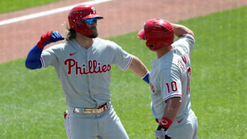 BUFFALO, NEW YORK - AUGUST 20: Bryce Harper #3 of the Philadelphia Phillies celebrates with teammate J.T. Realmuto #10 after hitting a one run home run during the first inning of game one of a double header against the Toronto Blue Jays at Sahlen Field on August 20, 2020 in Buffalo, New York. The Blue Jays are the home team and are playing their home games in Buffalo due to the Canadian government’s policy on coronavirus (COVID-19). (Photo by Bryan M. Bennett/Getty Images)