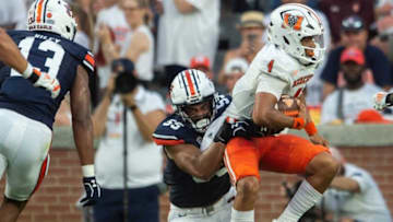 Auburn football defensive lineman Eku Leota (55) sacks Mercer Bears quarterback Fred Payton (4) as Auburn Tigers take on Mercer Bears at Jordan-Hare Stadium in Auburn, Ala., on Saturday, Sept. 3, 2022. Auburn Tigers leads Mercer Bears 28-7 at halftime.