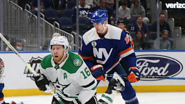 Mar 19, 2022; Elmont, New York, USA; Dallas Stars center Joe Pavelski (16) is checked from behind by New York Islanders defenseman Zdeno Chara (33) during the third period at UBS Arena. Mandatory Credit: Andy Marlin-USA TODAY Sports