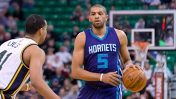 Jan 27, 2016; Salt Lake City, UT, USA; Charlotte Hornets guard Nicolas Batum (5) dribbles the ball as Utah Jazz forward Trey Lyles (41) defends during the first quarter at Vivint Smart Home Arena. Mandatory Credit: Russ Isabella-USA TODAY Sports