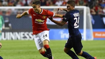 Jul 29, 2015; Chicago, IL, USA; Manchester United midfielder Andreas Pereira (44) kicks the ball past Paris Saint-Germain midfielder Marco Verratti (24) during the second half at Soldier Field. Paris Saint-Germain defeats Manchester United 2-0. Mandatory Credit: Mike DiNovo-USA TODAY Sports