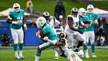 Nov 20, 2016; Los Angeles, CA, USA; Miami Dolphins wide receiver DeVante Parker (11) is tackled by Los Angeles Rams cornerback E.J. Gaines (33) during the first half of a NFL football game at Los Angeles Memorial Coliseum. Mandatory Credit: Kirby Lee-USA TODAY Sports