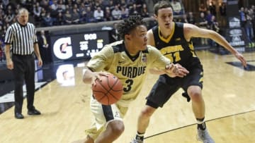 Dec 28, 2016; West Lafayette, IN, USA; Purdue Boilermakers guard Carsen Edwards (3) drives past Iowa Hawkeyes forward Nicholas Baer (51) in the first half at Mackey Arena. Mandatory Credit: Sandra Dukes-USA TODAY Sports