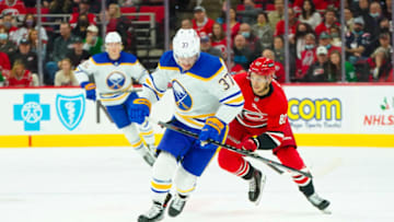 Dec 4, 2021; Raleigh, North Carolina, USA; Buffalo Sabres center Casey Mittelstadt (37) skates with the puck during the first period against the Carolina Hurricanes at PNC Arena. Mandatory Credit: James Guillory-USA TODAY Sports