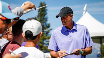 Former Duke basketball standout Jay Bilas signs autographs for fans. (Photo by Jonathan Devich/Getty Images)