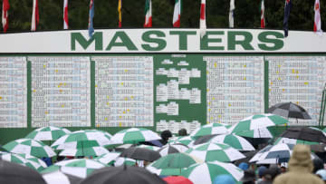 AUGUSTA, GEORGIA - APRIL 08: A general view of the leaderboard as patrons look on during the continuation of the weather delayed second round of the 2023 Masters Tournament at Augusta National Golf Club on April 08, 2023 in Augusta, Georgia. (Photo by Christian Petersen/Getty Images)