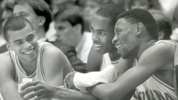 Indiana players from left, Jay Edwards, Dean Garrett and Keith Smart celebrate a Hoosiier victory from the bench. March 13, 1988.Edwards 2