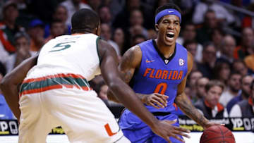 Dec 8, 2015; Coral Gables, FL, USA; Florida Gators guard Kasey Hill (0) is pressured by Miami Hurricanes guard Ja'Quan Newton (0) during the first half at BankUnited Center. Mandatory Credit: Steve Mitchell-USA TODAY Sports