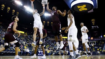 Dec 17, 2016; Ann Arbor, MI, USA; Michigan Wolverines forward D.J. Wilson (5) shoots on Maryland-Eastern Shore Hawks forward Isaac Taylor (35) in the first half at Crisler Center. Mandatory Credit: Rick Osentoski-USA TODAY Sports