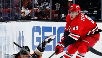ANAHEIM, CA - DECEMBER 7: Teuvo Teravainen #86 of the Carolina Hurricanes battles for the puck against Brandon Montour #26 of the Anaheim Ducks during the game on December 7, 2018 at Honda Center in Anaheim, California. (Photo by Debora Robinson/NHLI via Getty Images)