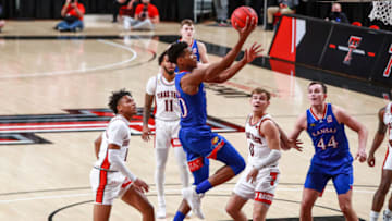 LUBBOCK, TEXAS - DECEMBER 17: Guard Ochai Agbaji #30 of the Kansas Jayhawks shoots a layup during the first half of the college basketball game against the Texas Tech Red Raiders at United Supermarkets Arena on December 17, 2020 in Lubbock, Texas. (Photo by John E. Moore III/Getty Images)