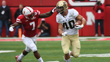 LINCOLN, NE - SEPTEMBER 29: Running back Alexander Horvath #40 of the Purdue Boilermakers runs from linebacker Mohamed Barry #7 of the Nebraska Cornhuskers in the first half at Memorial Stadium on September 29, 2018 in Lincoln, Nebraska. (Photo by Steven Branscombe/Getty Images)