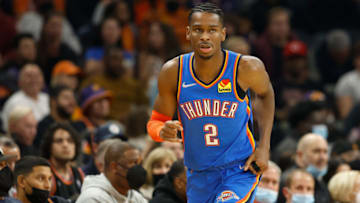 Shai Gilgeous-Alexander #2 of the Oklahoma City Thunder reacts after a three-point shot against the Phoenix Suns during the second half of the NBA game at Footprint Center on December 23, 2021 in Phoenix, Arizona. The Suns defeated the Thunder 113-101. NOTE TO USER: User expressly acknowledges and agrees that, by downloading and or using this photograph, User is consenting to the terms and conditions of the Getty Images License Agreement. (Photo by Christian Petersen/Getty Images)