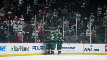 Minnesota Wild players celebrate after Joel Eriksson Ek 's first period goal during Game 3 of a Stanley Cup opening round series with Las Vegas. (Photo by David Berding/Getty Images)