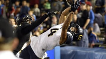 Oct 22, 2015; Pasadena, CA, USA; California Golden Bears wide receiver Kenny Lawler (4) makes a touchdown against UCLA Bruins defensive back Marcus Rios (9) during the second quarter at Rose Bowl. Mandatory Credit: Richard Mackson-USA TODAY Sports
