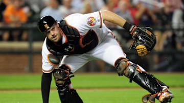 Sep 21, 2016; Baltimore, MD, USA; Baltimore Orioles catcher Matt Wieters (32) fields a ground ball in the sixth inning against the Boston Red Sox at Oriole Park at Camden Yards. Mandatory Credit: Evan Habeeb-USA TODAY Sports
