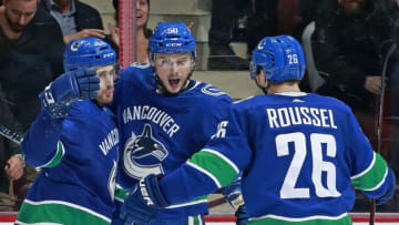 VANCOUVER, BC - OCTOBER 31: Brendan Gaunce #50 of the Vancouver Canucks is congratulated by teammates Tyler Motte #64 and Antoine Roussel #26 after scoring during their NHL game against the Chicago Blackhawks at Rogers Arena October 31, 2018 in Vancouver, British Columbia, Canada. (Photo by Jeff Vinnick/NHLI via Getty Images)