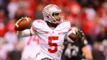 Dec 7, 2013; Indianapolis, IN, USA; Ohio State Buckeyes quarterback Braxton Miller (5) throws a pass during the third quarter of the 2013 Big 10 Championship game against the Michigan State Spartans at Lucas Oil Stadium. Mandatory Credit: Andrew Weber-USA TODAY Sports