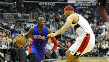 Mar 14, 2016; Washington, DC, USA; Detroit Pistons guard Reggie Jackson (1) dribbles the ball as Washington Wizards forward Jared Dudley (1) defends during the first half at Verizon Center. Mandatory Credit: Brad Mills-USA TODAY Sports