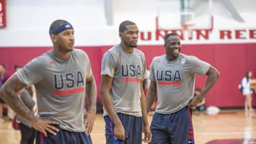Jul 19, 2016; Las Vegas, NV, USA; USA forward Carmelo Anthony (left) and guard Kevin Durant (middle) and forward Draymond Green (right) look on during a practice at Mendenhall Center. Mandatory Credit: Joshua Dahl-USA TODAY Sports