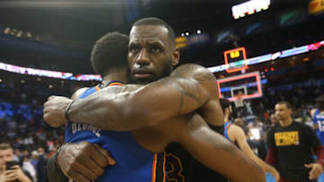 OKLAHOMA CITY, OK - FEBRUARY 13: LeBron James #23 of the Cleveland Cavaliers and Paul George #13 of the Oklahoma City Thunder hug after the game on February 13, 2018 at Chesapeake Energy Arena in Oklahoma City, Oklahoma. NOTE TO USER: User expressly acknowledges and agrees that, by downloading and or using this photograph, User is consenting to the terms and conditions of the Getty Images License Agreement. Mandatory Copyright Notice: Copyright 2018 NBAE (Photo by Layne Murdoch/NBAE via Getty Images)