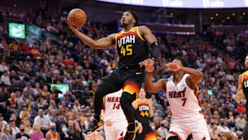 Nov 13, 2021; Salt Lake City, Utah, USA; Utah Jazz guard Donovan Mitchell (45) gets past Miami Heat guard Kyle Lowry (7) and goes to the basket during the second half at Vivint Arena. Miami Heat won 111-105. Mandatory Credit: Chris Nicoll-USA TODAY Sports