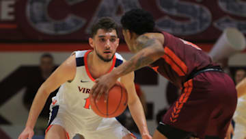 Ty Jerome #11 of the University of Virginia Cavaliers defends against Nickeil Alexander-Walker #4 of the Virginia Tech Hokies Atlanta Hawks (Photo by Lauren Rakes/Getty Images)