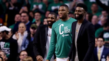 BOSTON, MA - APRIL 30: From left, Kyrie Irving #11 of the Boston Celtics, Guerschon Yabusele #30, and Jaylen Brown #7 cheer from the bench during the second quarter of Game One of Round Two of the 2018 NBA Playoffs against the Philadelphia 76ers at TD Garden on April 30, 2018 in Boston, Massachusetts. (Photo by Maddie Meyer/Getty Images)