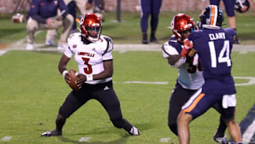 CHARLOTTESVILLE, VA - NOVEMBER 14: Malik Cunningham #3 of the Louisville Cardinals scrambles in the second half during a game against the Virginia Cavaliers at Scott Stadium on November 14, 2020 in Charlottesville, Virginia. (Photo by Ryan M. Kelly/Getty Images)