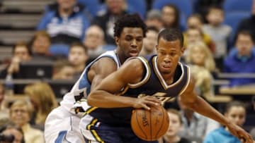Dec 30, 2015; Minneapolis, MN, USA; Minnesota Timberwolves guard Andrew Wiggins (22) defends Utah Jazz guard Rodney Hood (5) in the first quarter at Target Center. Mandatory Credit: Bruce Kluckhohn-USA TODAY Sports