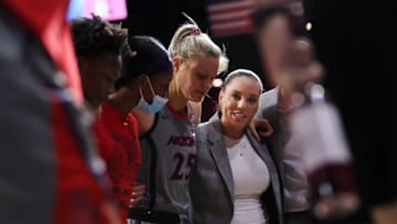 TUCSON, ARIZONA - FEBRUARY 06: Head coach Adia Barnes of the Arizona Wildcats huddles with her team before their game against the Oregon State Beavers at McKale Center on February 06, 2022 in Tucson, Arizona. The Arizona Wildcats won 73-61. (Photo by Rebecca Noble/Getty Images)