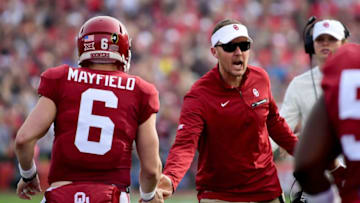 PASADENA, CA - JANUARY 01: Baker Mayfield #6 of the Oklahoma Sooners shakes hands with head coach Lincoln Riley during the 2018 College Football Playoff Semifinal Game against the Georgia Bulldogs at the Rose Bowl Game presented by Northwestern Mutual at the Rose Bowl on January 1, 2018 in Pasadena, California. (Photo by Harry How/Getty Images)