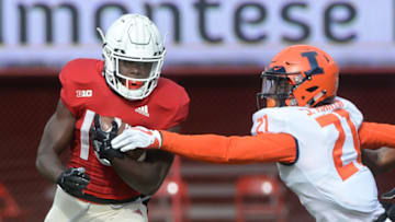 LINCOLN, NE - NOVEMBER 10: Wide receiver JD Spielman #10 of the Nebraska Cornhuskers escapes the tackle of defensive back Jartavius Martin #21 of the Illinois Fighting Illini in the second half at Memorial Stadium on November 10, 2018 in Lincoln, Nebraska. (Photo by Steven Branscombe/Getty Images)