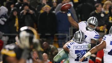 Nov 13, 2016; Pittsburgh, PA, USA; Dallas Cowboys running back Ezekiel Elliott (21) is hoisted by center Travis Frederick (72) after scoring the game-winning touchdown against the Pittsburgh Steelers during the second half of their game at Heinz Field. The Cowboys won the game, 35-30. Mandatory Credit: Jason Bridge-USA TODAY Sports