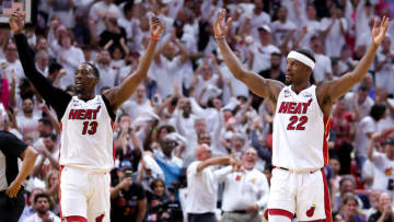 MIAMI, FLORIDA - MAY 21: Jimmy Butler #22 and Bam Adebayo #13 of the Miami Heat react during the third quarter against the Boston Celtics in game three of the Eastern Conference Finals at Kaseya Center on May 21, 2023 in Miami, Florida. NOTE TO USER: User expressly acknowledges and agrees that, by downloading and or using this photograph, User is consenting to the terms and conditions of the Getty Images License Agreement. (Photo by Megan Briggs/Getty Images)