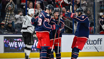 Dec 11, 2022; Columbus, Ohio, USA; Columbus Blue Jackets left wing Johnny Gaudreau (13) celebrates his game winning goal against the Los Angeles Kings with Columbus Blue Jackets left wing Patrik Laine (29), center Jack Roslovic (96) and defenseman Vladislav Gavrikov (4) in overtime at Nationwide Arena. Mandatory Credit: Gaelen Morse-USA TODAY Sports